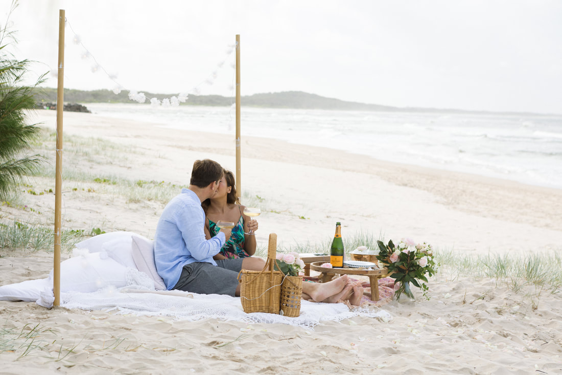 Romantic picnic, of an engagement. A photo taken in Noosa on the Sunshine Coast 